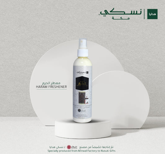 Bottle of AlHaram Freshener with a white and gold label